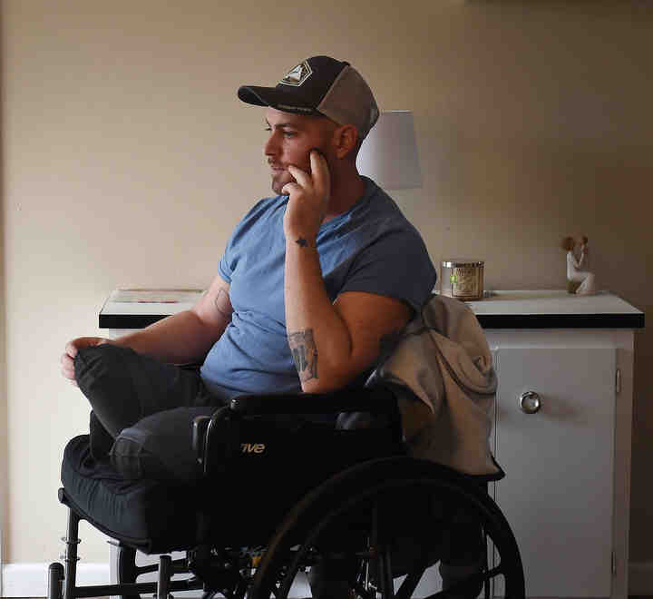 Andrew Lemley, in his parent's Streetsboro home. Lemley lost both legs after a car accident where he was pinned between cars.